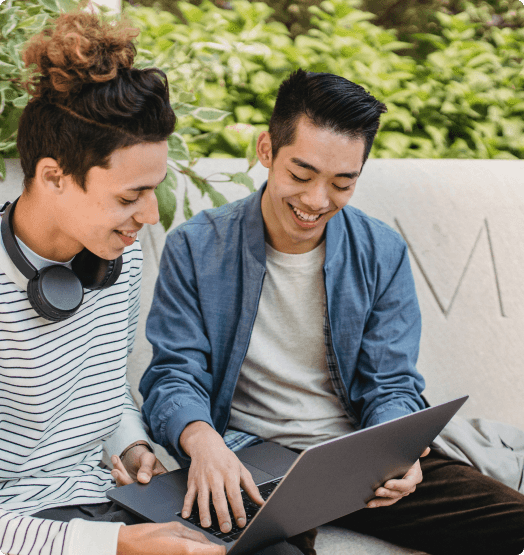 A few young man looking at a laptop